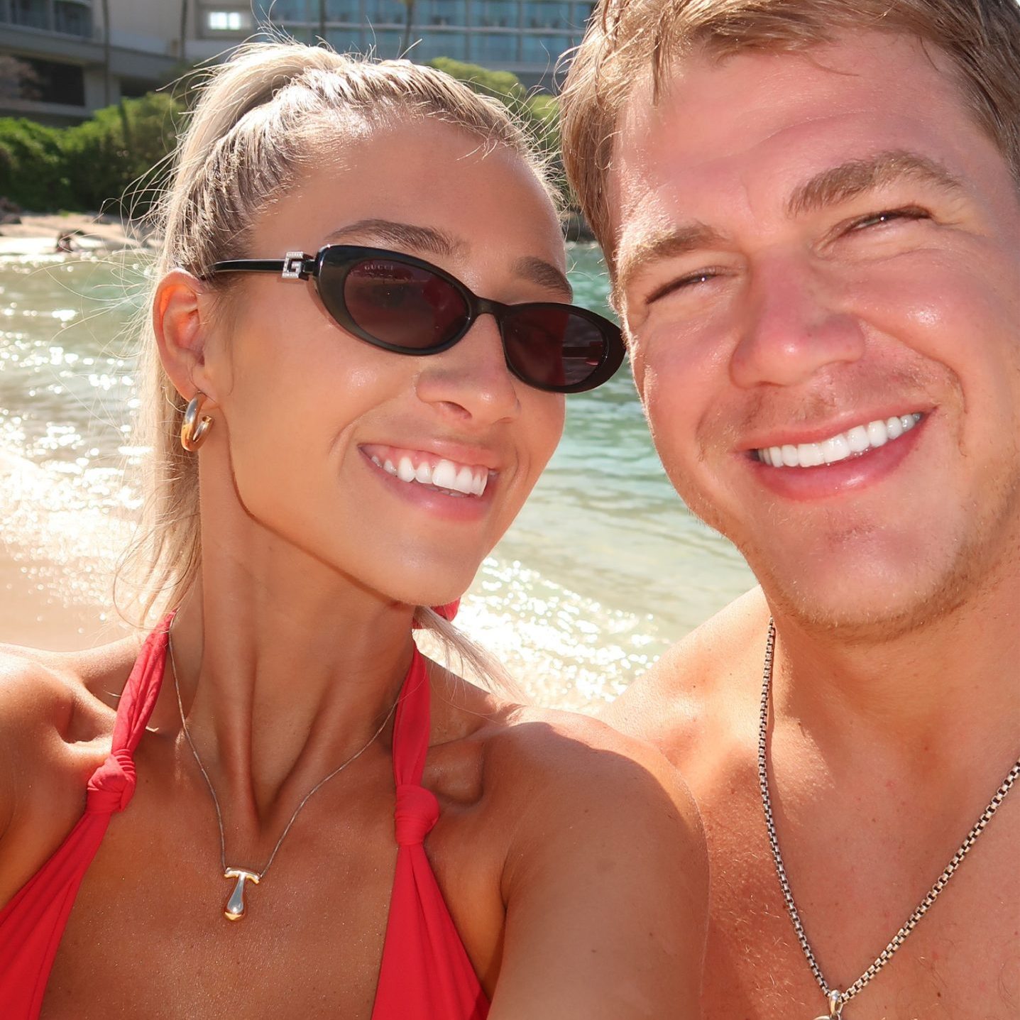 Couple at the beach with sweat-resistant spray tans by Sunny Daze Sunless in Lawrence, Kansas