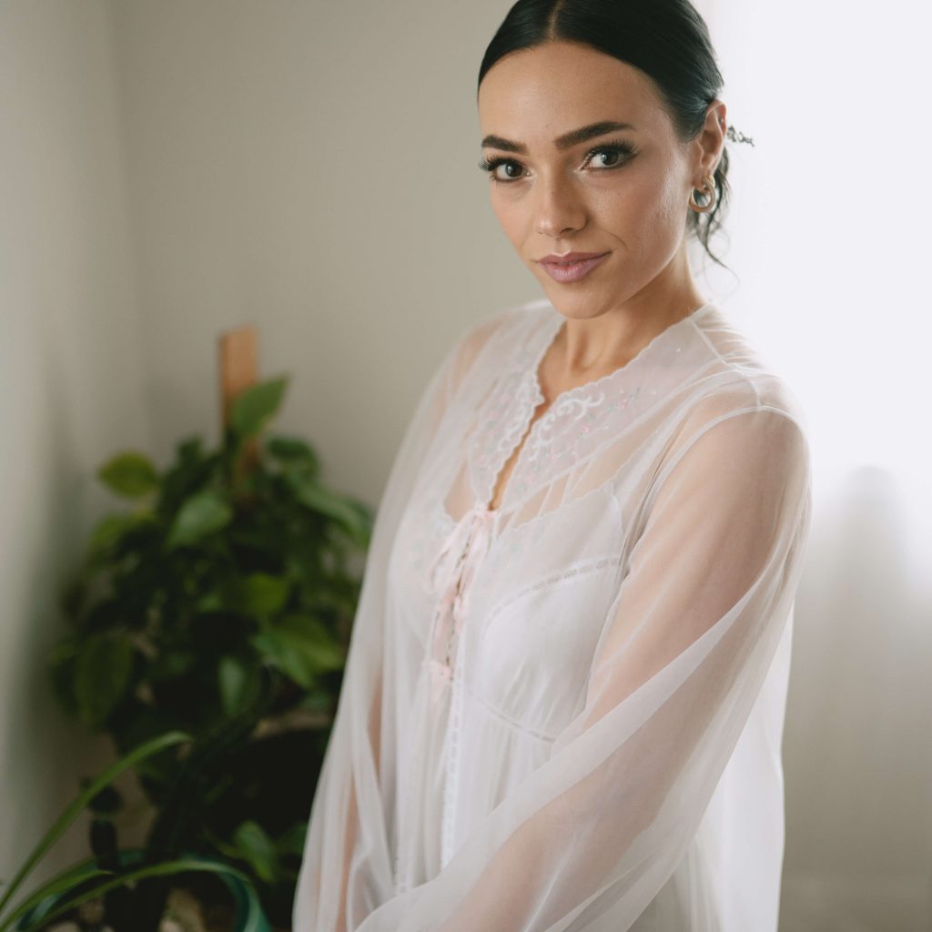 Bride getting ready with natural spray tan by Sunny Daze Sunless — mobile bridal tanning Lawrence KS and Kansas City