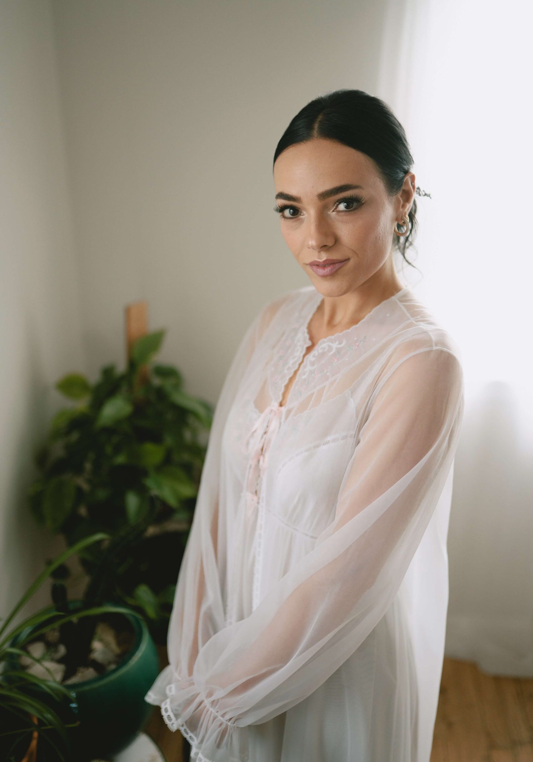 Bride getting ready with natural spray tan by Sunny Daze Sunless — mobile bridal tanning Lawrence KS and Kansas City