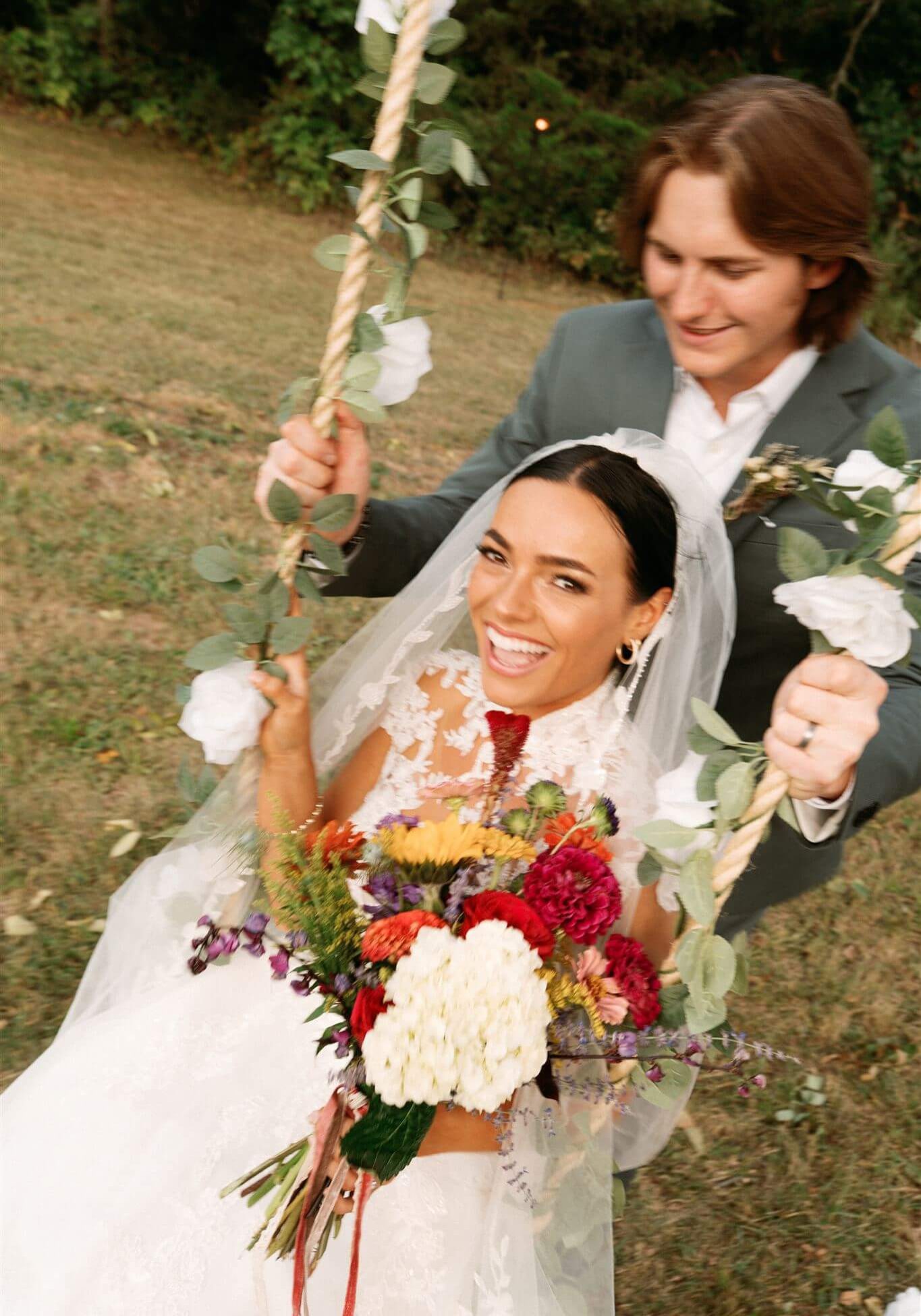 Bride and bridesmaid with glowing, golden spray tans by Sunny Daze Sunless mobile spray tan service in Prairie Village, Kansas.