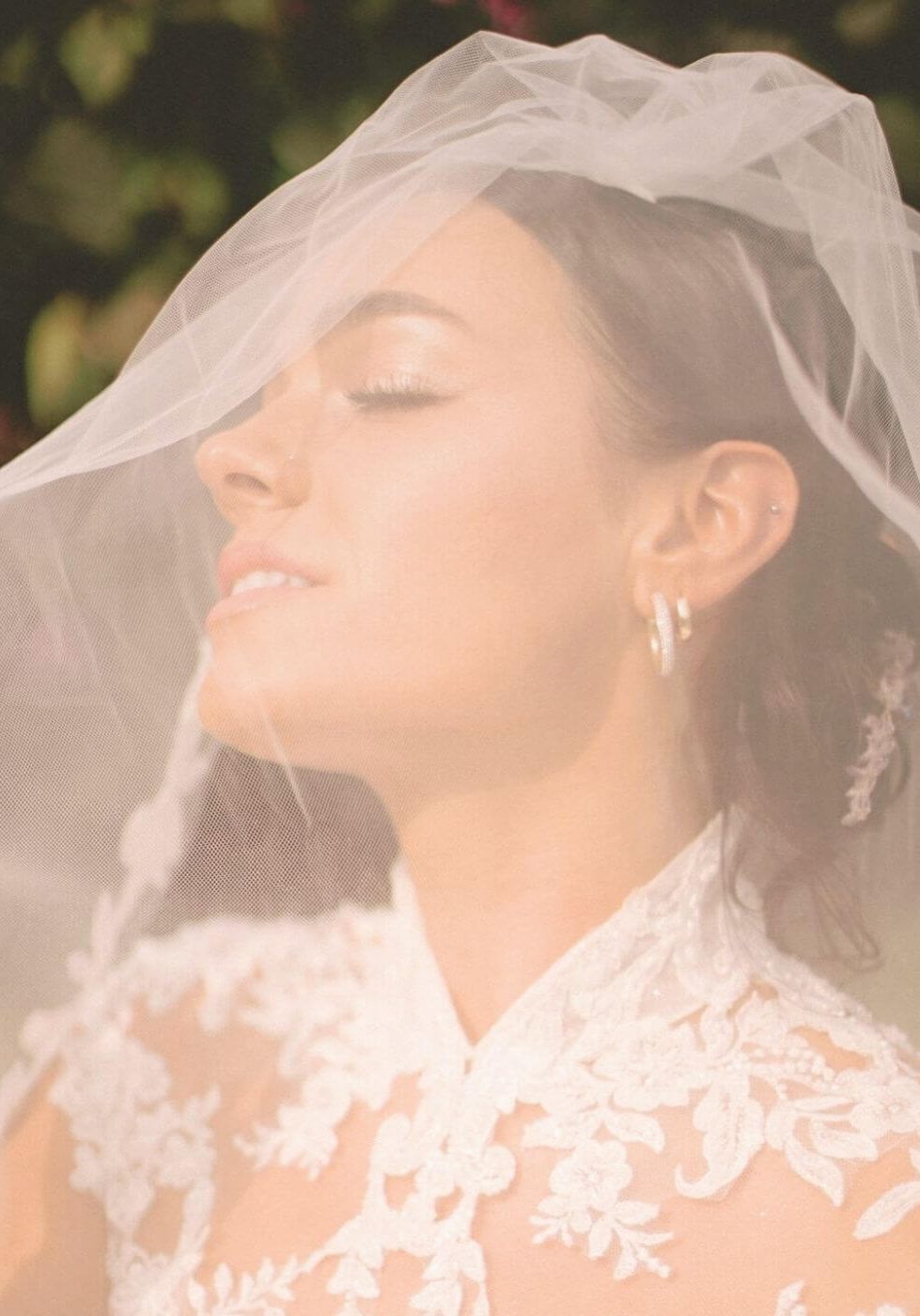 Close up of bride with natural bronzed spray tan under veil - bridal tanning by Sunny Daze Sunless, serving Lawrence and Johnson County KS